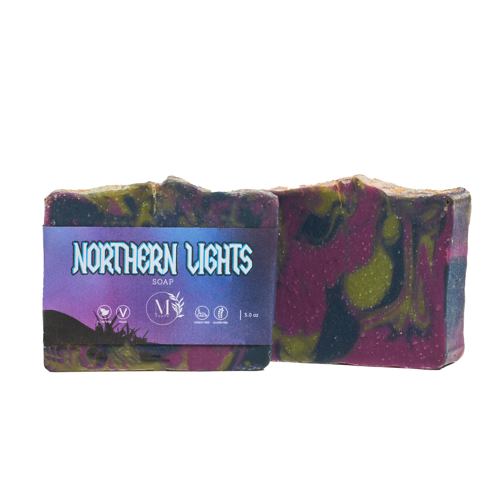 Northern Lights Soap featuring vibrant purple, green, and black swirls with a night-sky themed label.